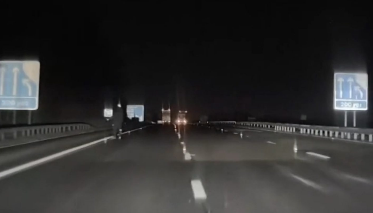 A real life ‘slender man’ appears on a British highway